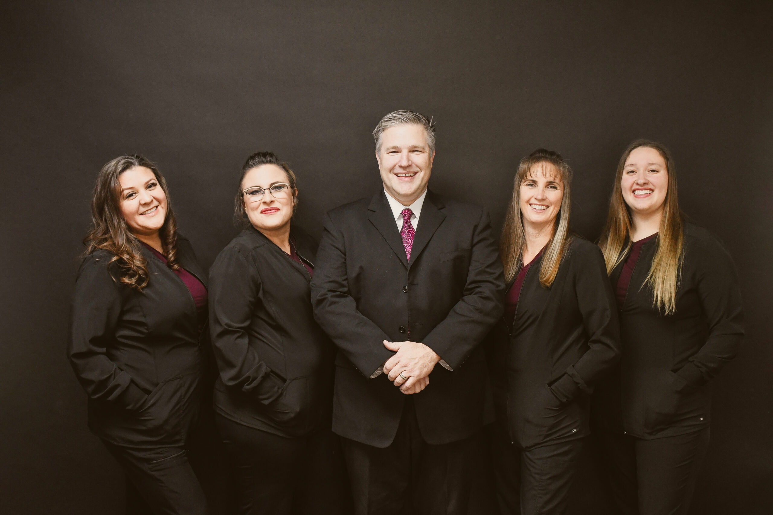 Dr. Matthew Bergman, Sheyla Padilla, McKaylee Burton, Emily VanOtten, Apryll Freeman, the entire dental care team of Red Hills Dental on a formal pose for pictorial - Dentist St George Utah Dr. Matthew Bergman, Sheyla Padilla, McKaylee Burton, Emily VanOtten, Apryll Freeman, the entire dental care team of Red Hills Dental on a formal pose for pictorial - Dentist St George Utah